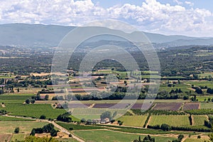 Panoramic view of valley,ÃÂ cultivated fruits plantations, forests, farms, mountains on horizon from uptown medieval village